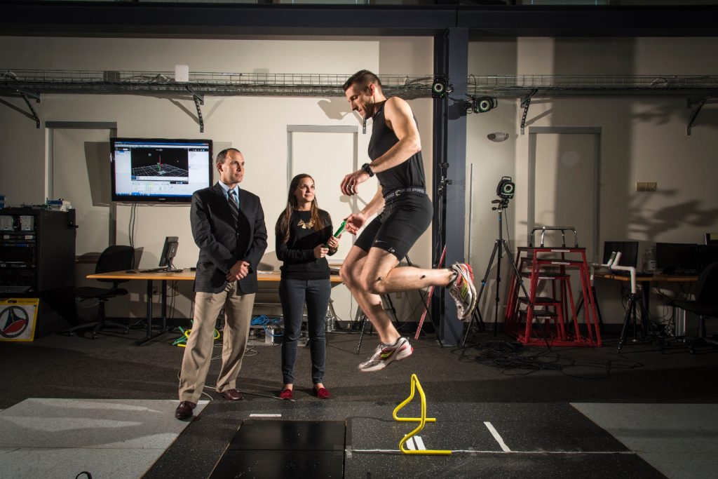 Heather Bansbach, a doctoral student at the Pitt Neuromuscular Research Laboratory, conducts a demonstration of the portable motion capture plaform she is developing under the tutelage of assistant professor Timoth Sell (left).